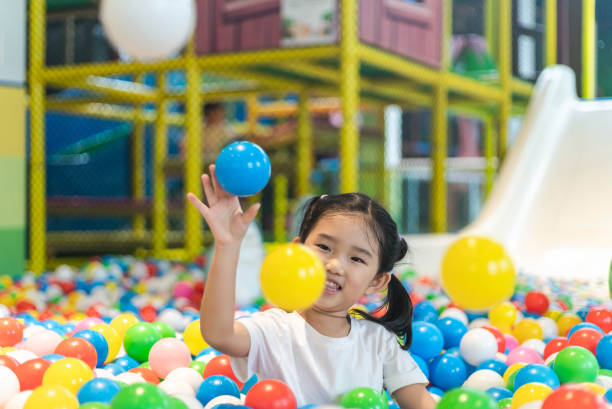 istock Cute girl at the Ball Pool 1192089176