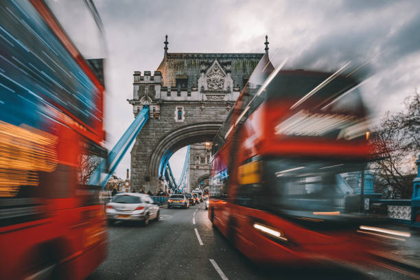 istock Speeding double-decker light trails on Tower Bridge in London, UK 1192090008