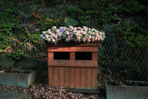 Unique wooden trash bin with flower decoration