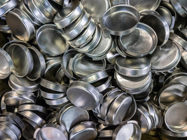 istock batch of olod stamped shiny metal caps, selective focus top-down wiew 1192090503