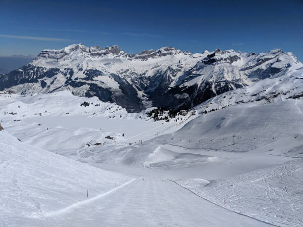 istock scenic view of snow covered mountains against sky 1192091246