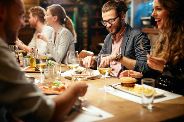 istock Friends having dinner at retaurant. 1192095101