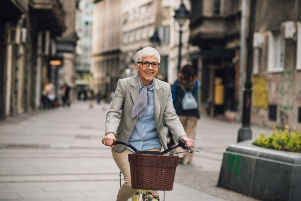 istock Senior woman cycling to work 1192097868
