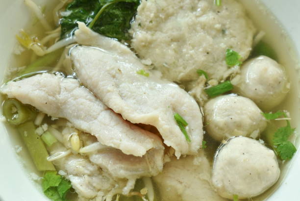 istock boiled soft slice pork and ball in clear soup 1192098528