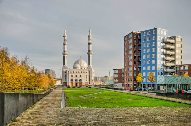 Rotterdam, The Netherlands, November 24, 2019: the Essalam mosque with adjacent park and modern residential buildings