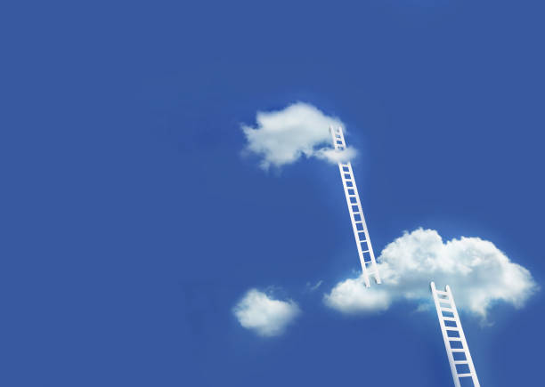 istock White ladder leading to white clouds on blue sky 1192101451
