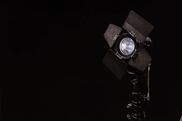 istock Spotlight with directional light with a Fresnel lens on black background 1192101524