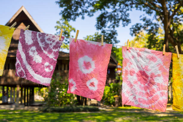 Colorful Abstract tie dyed fabric  hung up to dry. Colorful Abstract tie dyed fabric  hung up to dry. dye stock pictures, royalty-free photos & images