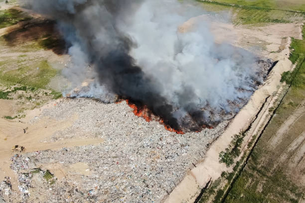 istock Burning trash. fire at the landfill. Burning garbage. 1192101748