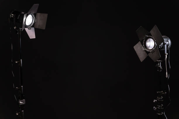 Two LED stage lights with protective shutters on black background