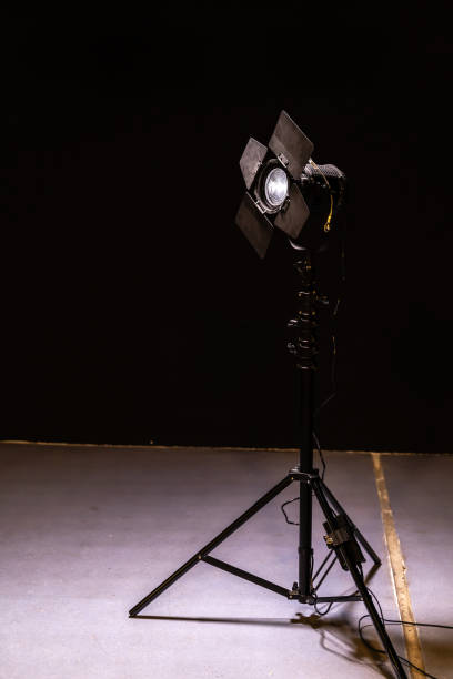 istock Spotlight with directional light with a Fresnel lens on tripod 1192101905