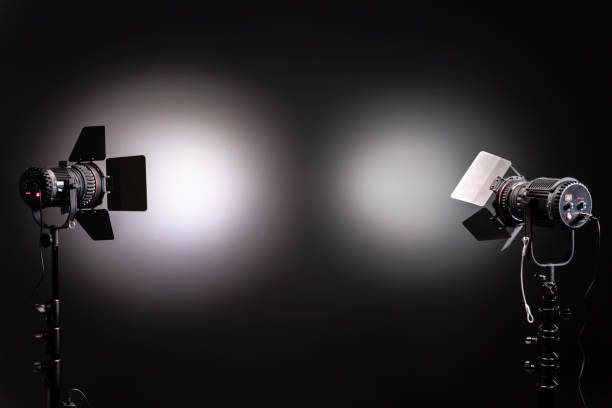 istock Two LED stage lights with protective shutters on black and grey background 1192101984