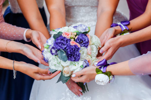 istock Wedding bouquet and hands of bridesmaids. 1192102036