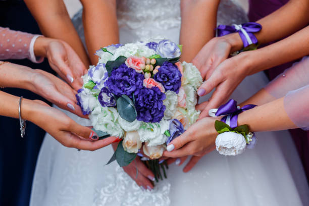 istock Wedding bouquet and hands of bridesmaids. 1192102368
