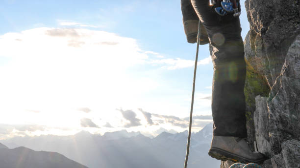 istock Mountaineer climbs up mountain ridge 1192103006