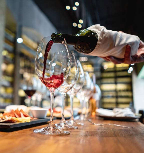 istock Sommelier pouring wine in a glass at a cellar 1192104528