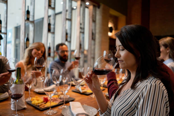 istock Woman tasting wine at a cellar 1192104779