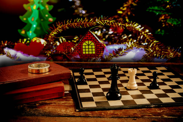 istock Chess on board with text book with Christmas decorate . 1192104961