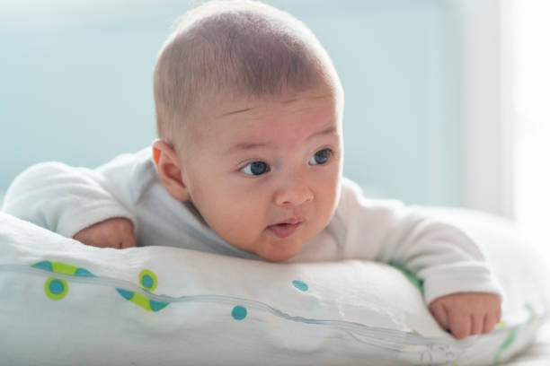 istock Cute baby lying on bed 1192105027
