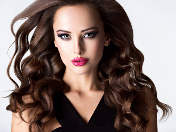 istock Beautiful woman with long curly hair 1192105231