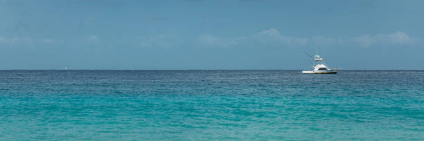 istock White yacht on blue ocean 1192106610