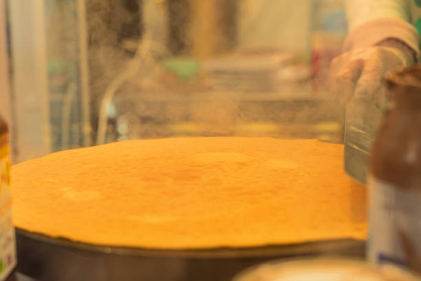 French pancake cooking process. Street food in Paris