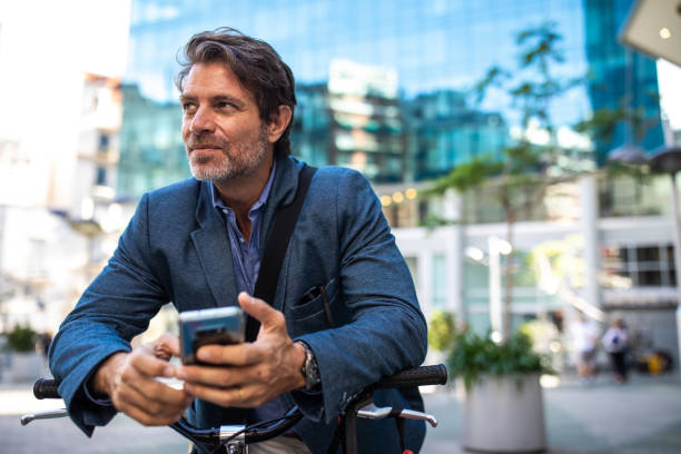 istock Business on bike text messaging 1192108169