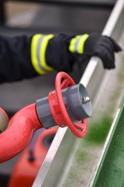 istock Fire fighter staying in position next to a hydrant 1192109060