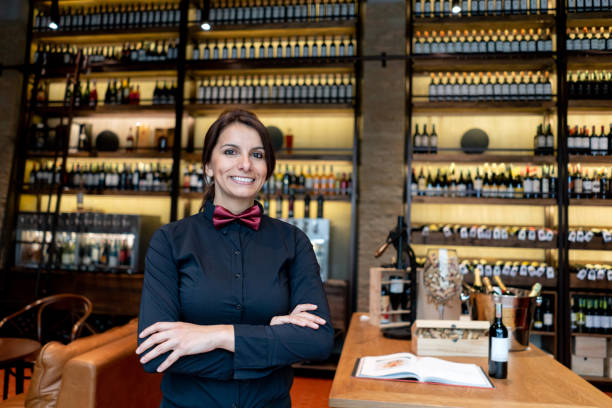 istock Happy sommelier working at a cellar selling wines 1192109293