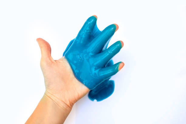 istock Violet slime in hand, isolated on white. 1192109823