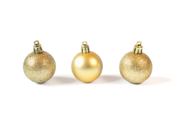 istock Three Golden baubles isolated on white background. Christmas decoration concept 1192111014