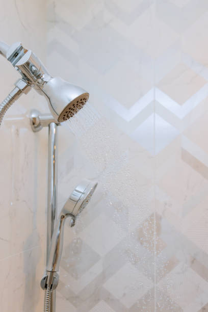 istock Close up on head shower running water drops flowing 1192111184