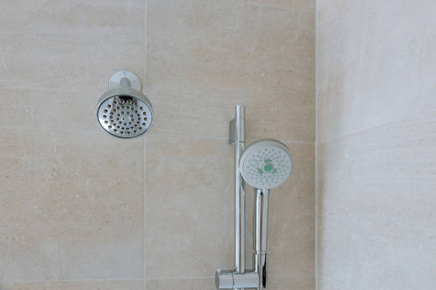 istock New shower head in the bathroom, close-up wall 1192111187