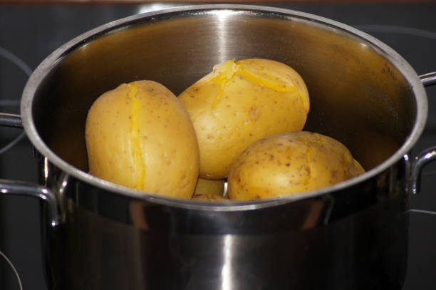 istock Cooked pell potatoes with peel in pot 1192111254