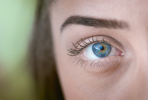 Macro photograph of a young woman's eye.