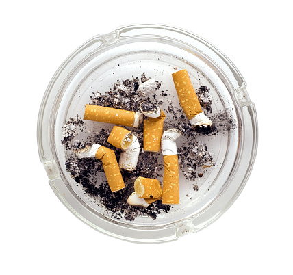 ashtray full of cigarettes close-up isolated on white background