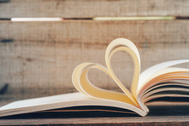 istock Shape heart create from book page,love concept. 1192113783