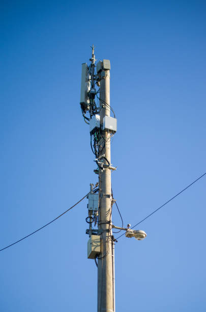 istock antenna with telecommunication equipment on blue sky background 1192115004