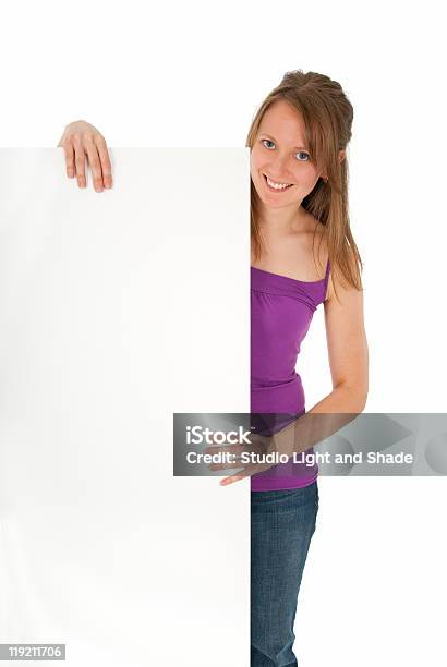 Casual Young Women Holding A Blank Banner Ad Stock Photo - Download Image Now - Adult, Adults Only, Advertisement