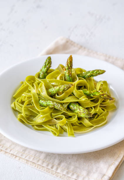 istock Spinach fettuccine with fried asparagus 1192119058
