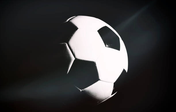 istock soccer ball isolated on black background. 1192119746