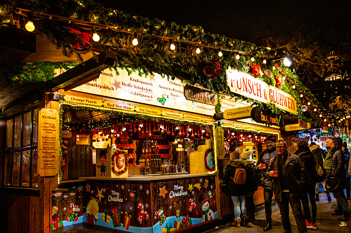 Vienna, Austria, 2 December 2019. Christmas market near Rathaus. People  drinking mulled wine and punsh.