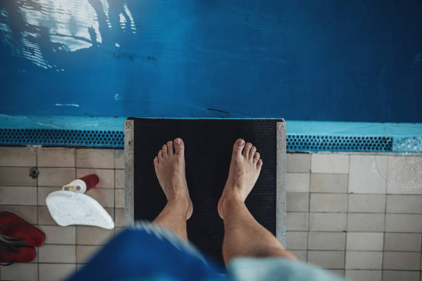 istock Senior man doing exercises near the swimming pool 1192122290