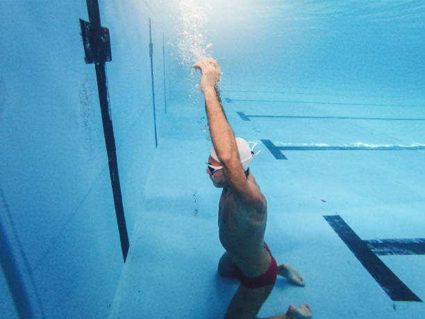 istock Senior man diving in water 1192124428
