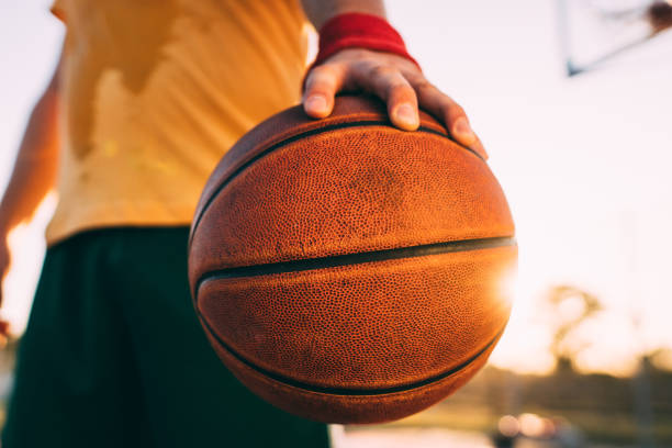 istock Basketball player holding ball 1192126603
