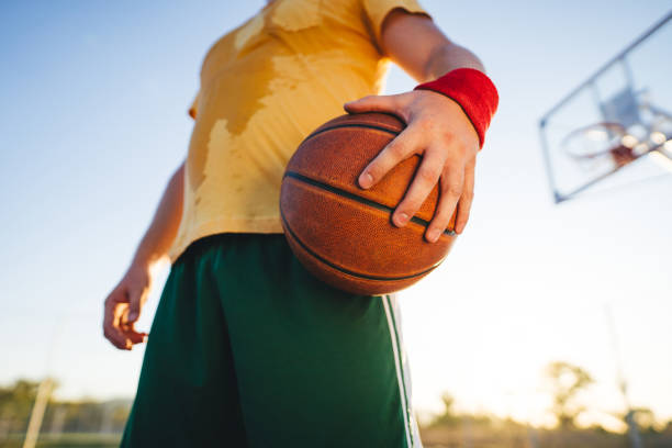 istock Basketball player holding ball 1192126893