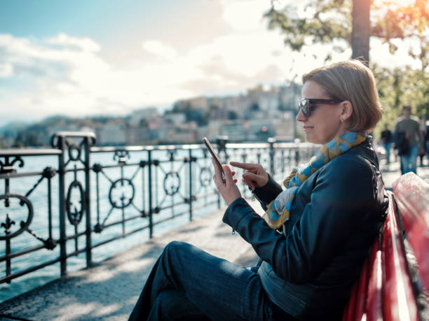 istock Woman using a phone in Lugano 1192129228