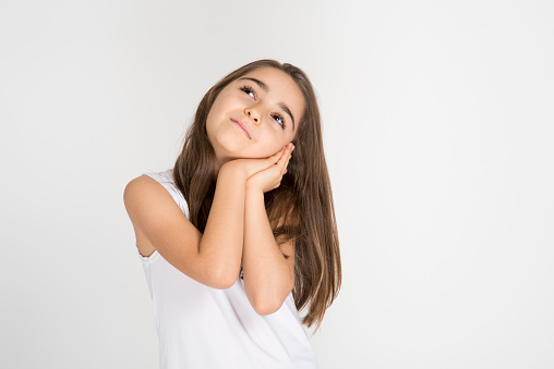 Pretty kid looking away isolated on white.Happy thoughts