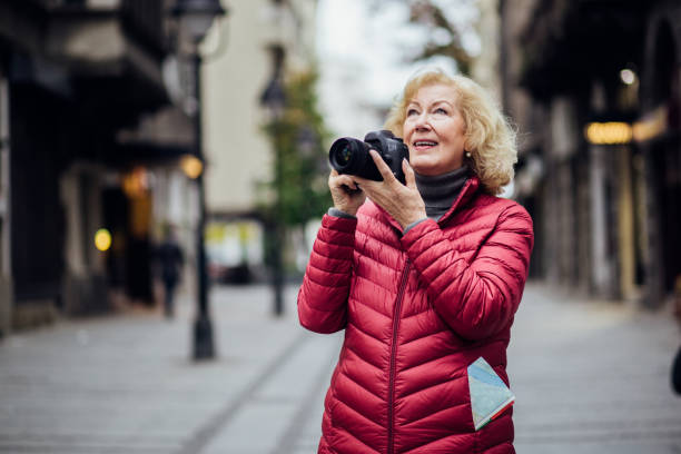 istock Excited senior lady exploring the new city 1192130438