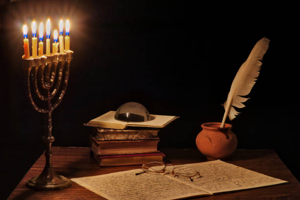 istock Ancient writer's working desk with menorah 1192131439